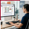 a female data center operator at a desktop looking at a data center floorplan graphic