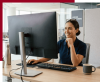 Female data center operator working at a desk